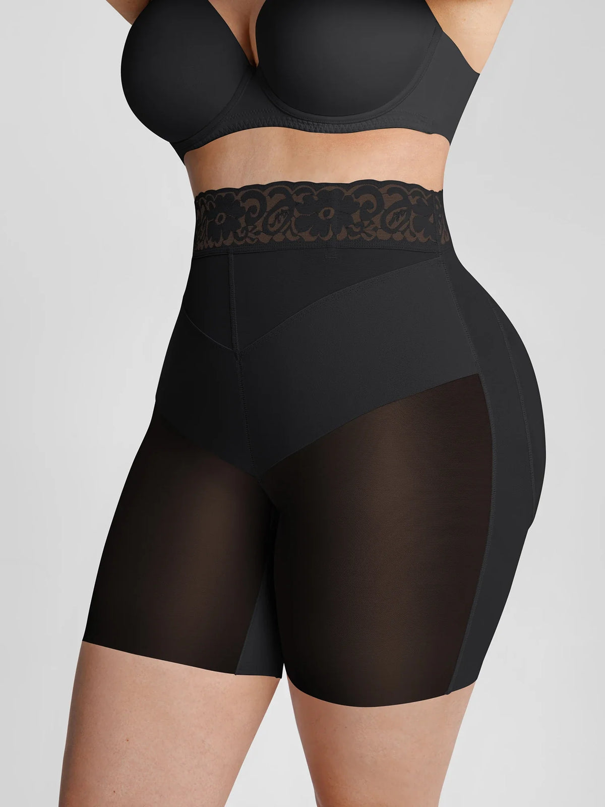 Side view of black shapewear highlighting the double-layer panels and high-tension V-band tummy control
