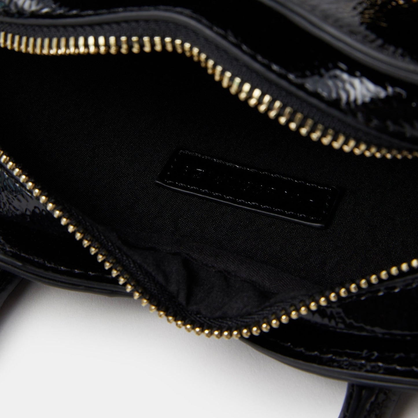 Black Patent Heart Handheld Sling
