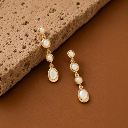 Faux pearl drop earrings in Blue