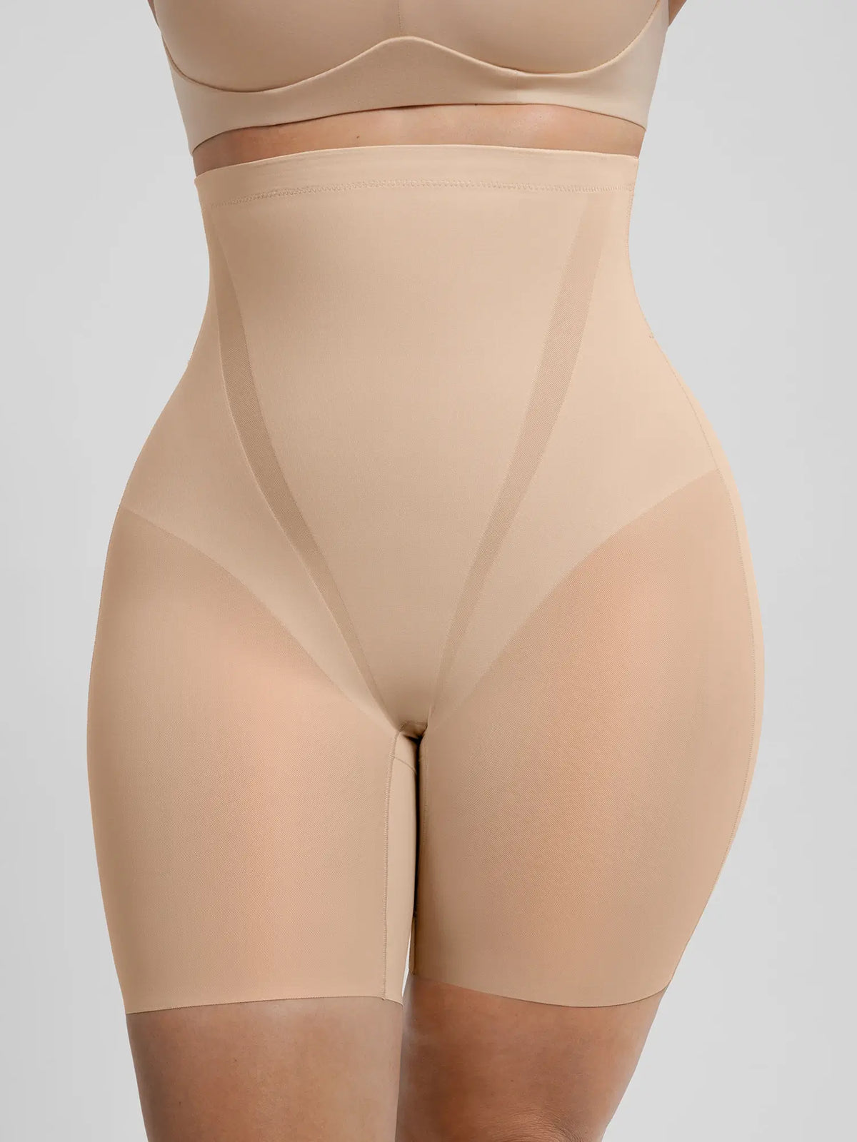 Front view of tummy control shaper shorts featuring double-layer breathable sculpting with high-tension perforated mesh
