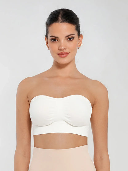 Front view of a model in a white seamless bandeau bra with gentle support and invisible second-skin comfort