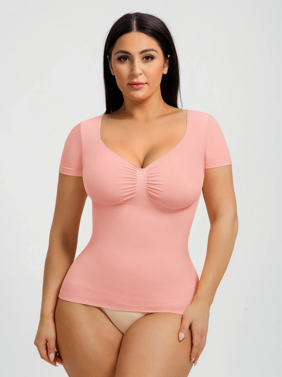 Seamless shapewear top with targeted tummy control, ruched bust support, and a stay-put silicone hem, designed to smooth, sculpt, and enhance your natural curves with all-day comfort and confidence.