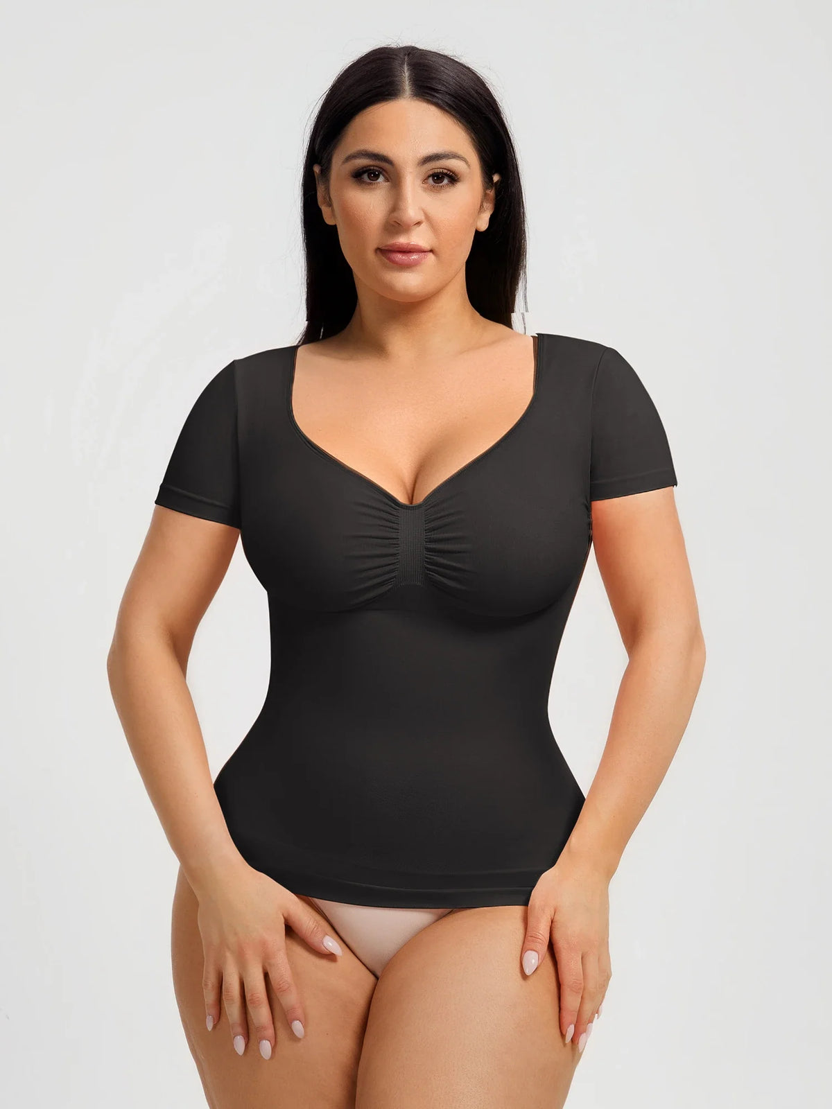 Seamless shapewear top with targeted tummy control, ruched bust support, and a stay-put silicone hem, designed to smooth, sculpt, and enhance your natural curves with all-day comfort and confidence.