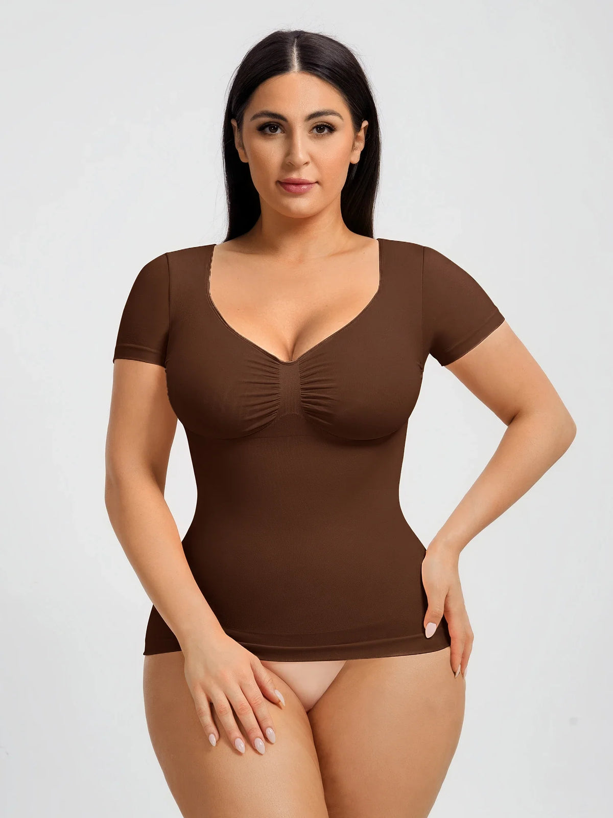 Seamless shapewear top with targeted tummy control, ruched bust support, and a stay-put silicone hem, designed to smooth, sculpt, and enhance your natural curves with all-day comfort and confidence.