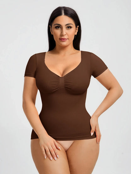 Seamless shapewear top with targeted tummy control, ruched bust support, and a stay-put silicone hem, designed to smooth, sculpt, and enhance your natural curves with all-day comfort and confidence.