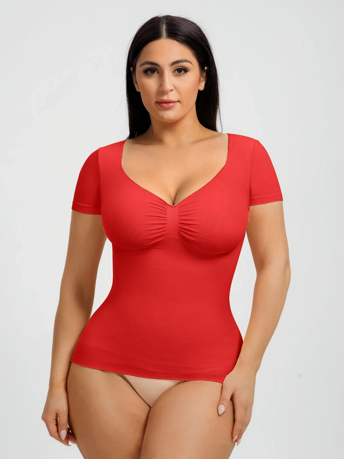 Seamless shapewear top with targeted tummy control, ruched bust support, and a stay-put silicone hem, designed to smooth, sculpt, and enhance your natural curves with all-day comfort and confidence.