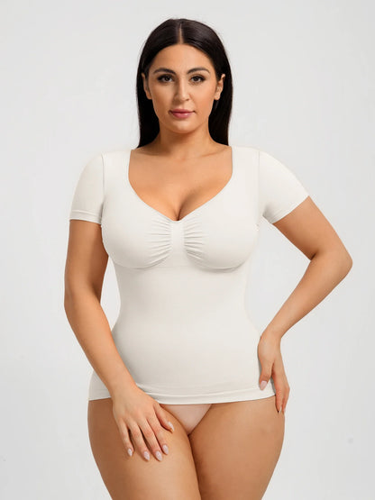 Seamless shapewear top with targeted tummy control, ruched bust support, and a stay-put silicone hem, designed to smooth, sculpt, and enhance your natural curves with all-day comfort and confidence.