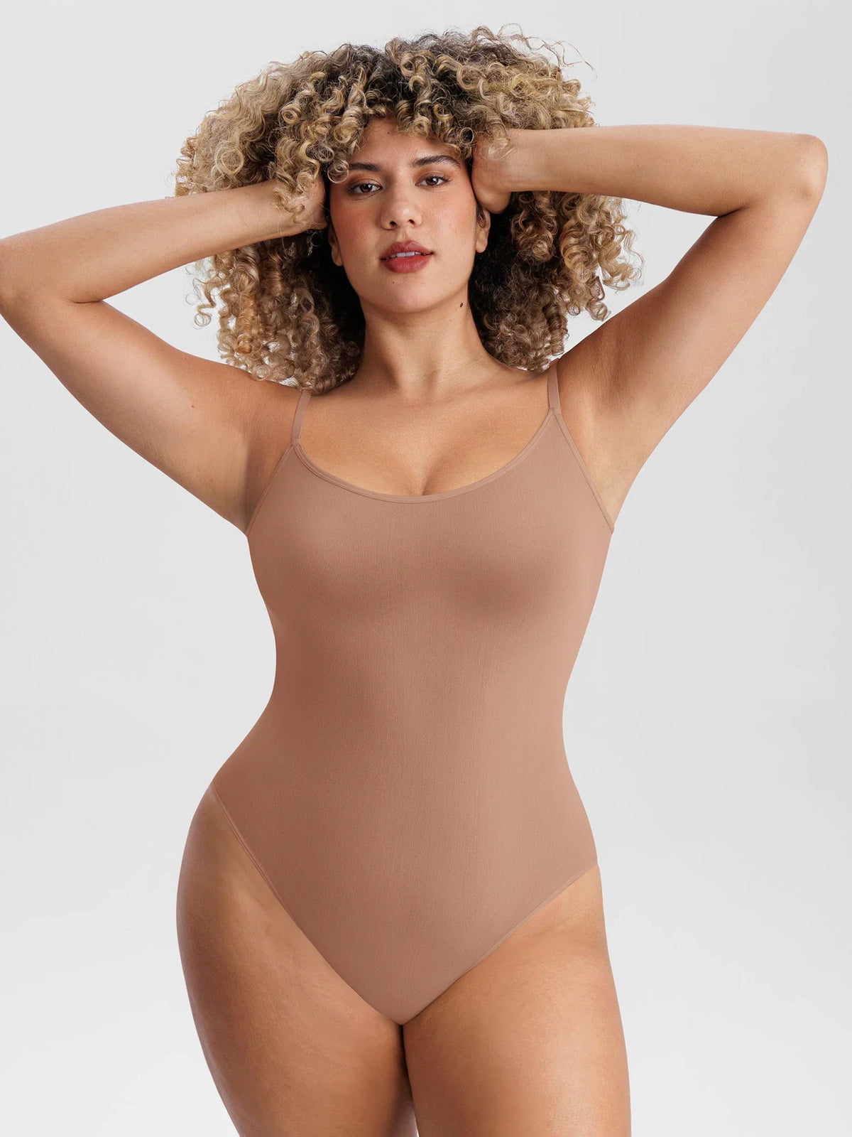 Lightweight seamless mesh bodysuit designed for sculpting comfort, breathable support, and all-day styling.