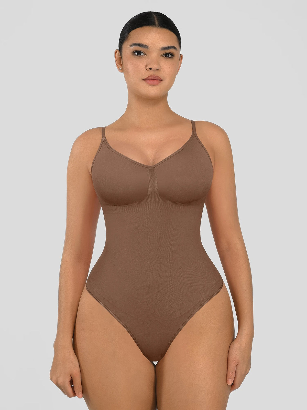 Seamless shapewear bodysuit with tummy control and thong design—lightweight, invisible under clothes, and designed for all body types for everyday wear, office, or parties.