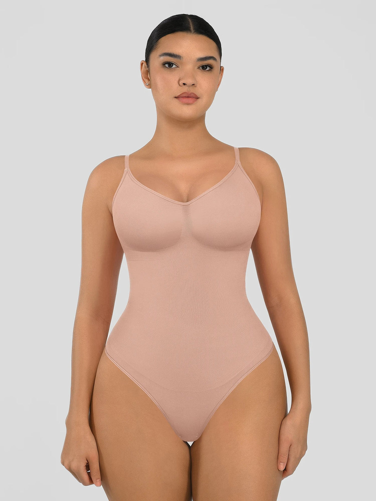 Seamless shapewear bodysuit with tummy control and thong design—lightweight, invisible under clothes, and designed for all body types for everyday wear, office, or parties.