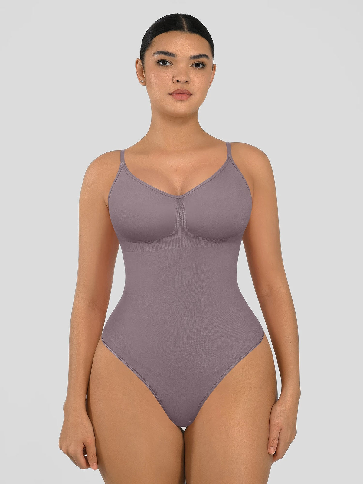 Seamless shapewear bodysuit with tummy control and thong design—lightweight, invisible under clothes, and designed for all body types for everyday wear, office, or parties.