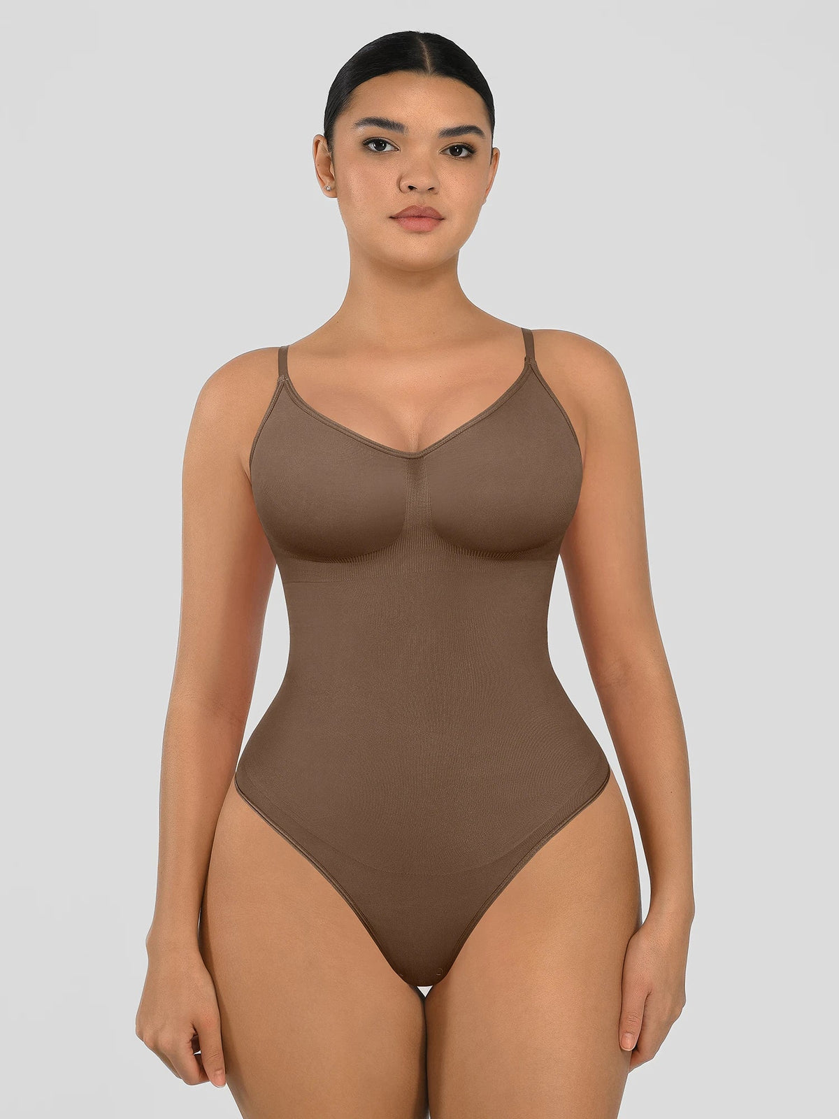 Seamless shapewear bodysuit with tummy control and thong design—lightweight, invisible under clothes, and designed for all body types for everyday wear, office, or parties.