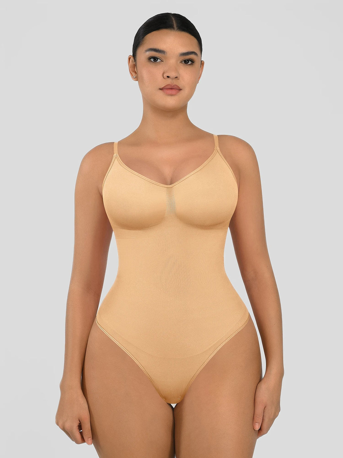 Seamless shapewear bodysuit with tummy control and thong design—lightweight, invisible under clothes, and designed for all body types for everyday wear, office, or parties.