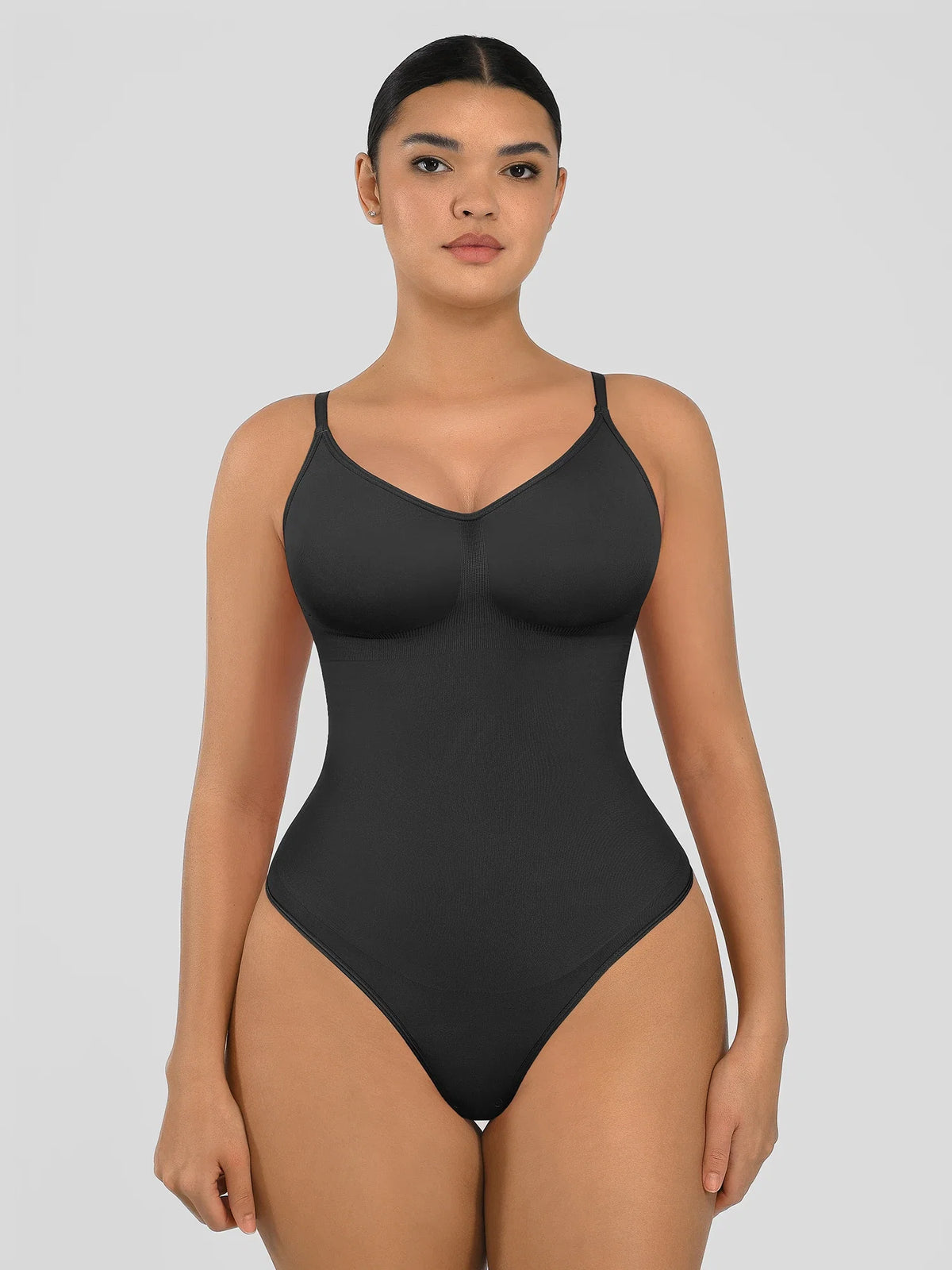 Seamless shapewear bodysuit with tummy control and thong design—lightweight, invisible under clothes, and designed for all body types for everyday wear, office, or parties.