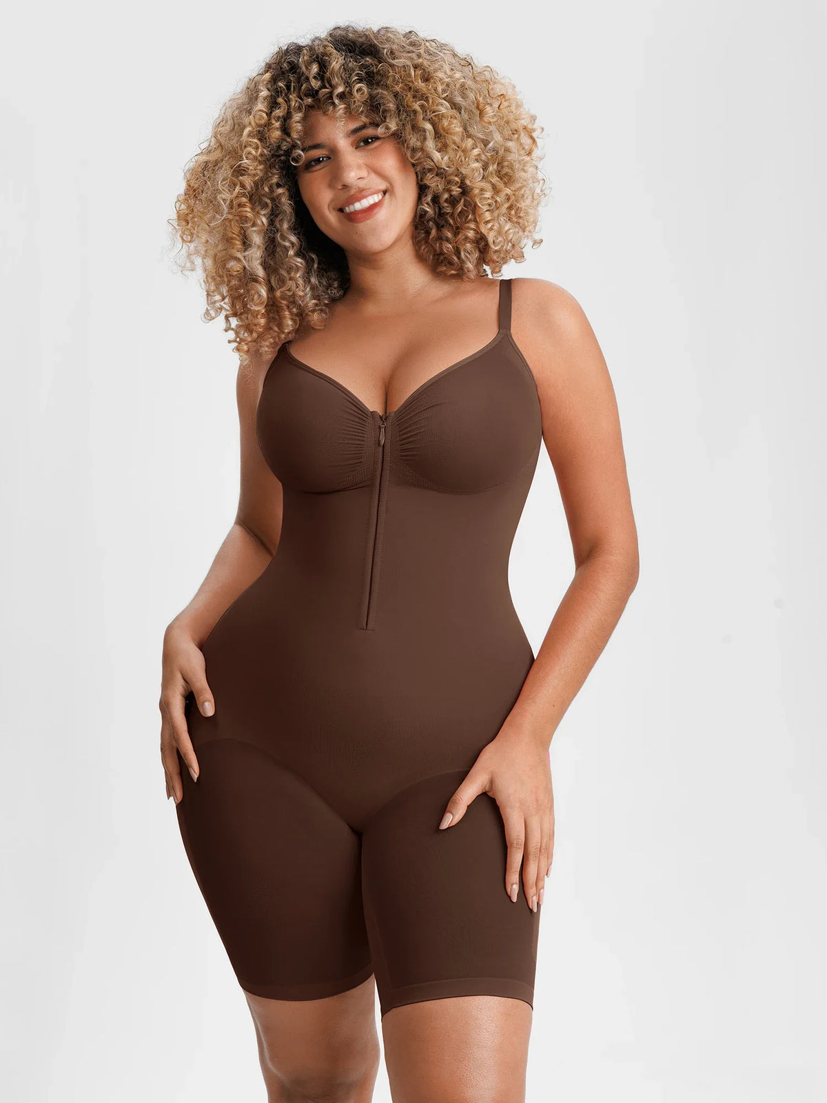 Seamless tummy control bodysuit with front zipper and inner hooks for easy wear and secure fit. Smooth compression shapes waist and tummy while staying invisible under clothes. Butt-lifting design enhances curves and smooths leg lines. Ruched bust adapts to different cup sizes. Soft breathable stretch fabric with adjustable straps and gusset for all-day comfort. 