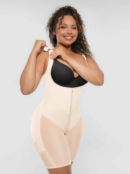 Model demonstrating the adjustable shoulder straps on a beige open bust tummy control body shaper